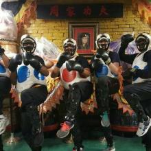 Four adults geared up for sparring